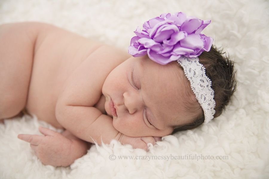 baby girl with purple flower headband