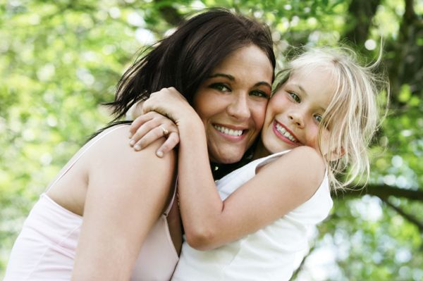 mom hugging daughter