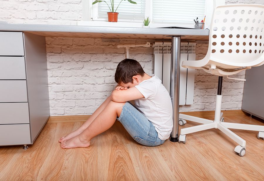 bigstock Sad And Unhappy Child Sitting 378088177