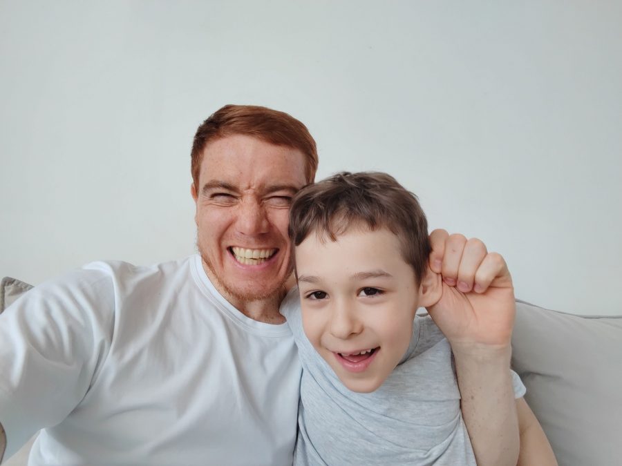 Selfie Son And Dad, The Concept Of Family Values And Selfie Photo. Little Boy With His Dad Taking Se