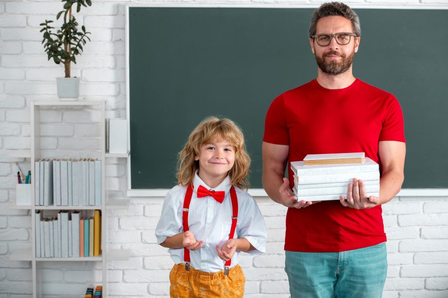 School Education And Children Concept. Pupil Of Primary Elementary School Has Lesson. Kid Boy With T