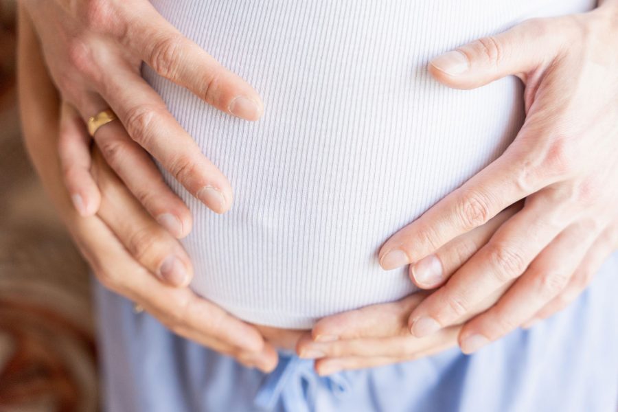 Pregnant Hands Woman Belly. Happy Pregnancy Woman And Husband Hugging Pregnant Belly. Concept Matern